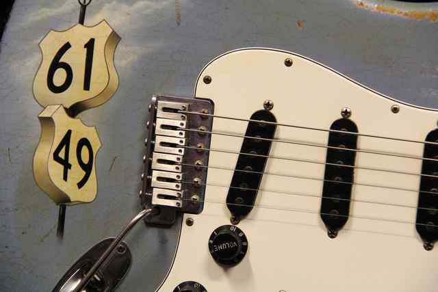 Crossroads Fender with closeup of tune controls and output jacks Crossroads Fender with closeup of tune controls and output jacks