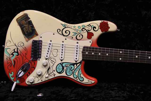 Monterey Fender with intricate red and teal design on body Monterey Fender with intricate red and teal design on body