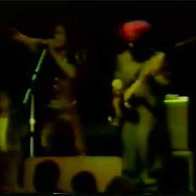 Performs on stage with his father and brother