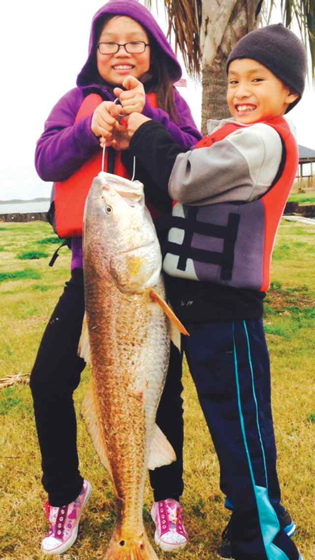 Michelle & Colin Tran Sabine Pass32&quot; first redfish!