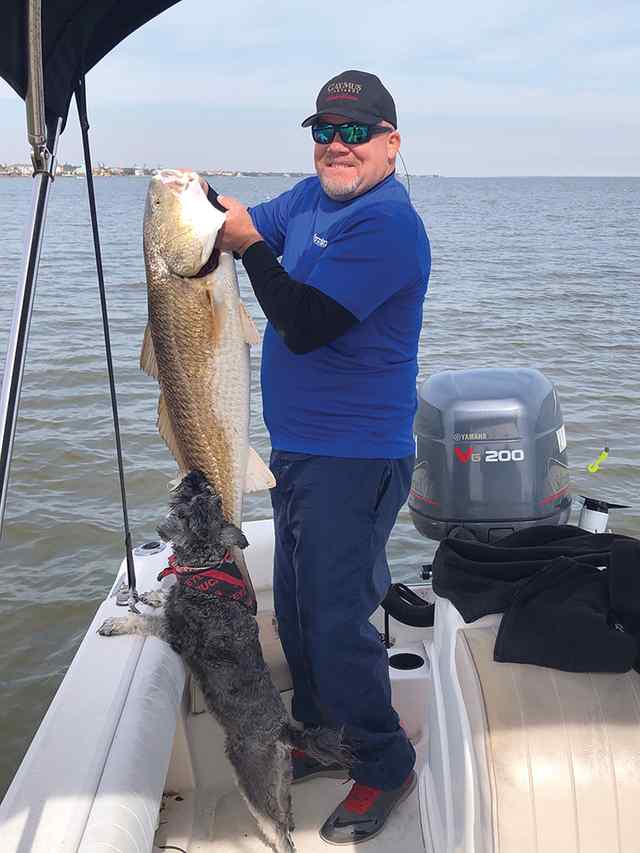 Tom Walsh Seabrook Flats - redfish, with his dog, Buckeye