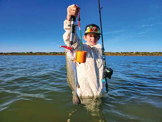 Benjamin Lyon Lower Laguna Madre - first trout! CPR, caught on Kwiggler 4" paddle tail punch metal flake/cool