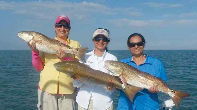 Mary Ramirez with Ronnie Garza & Lory Handy South Padreredfish