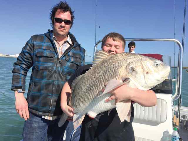 Joey Van Delden with friend, Buck Schott Port Aransas, Intercoastal Waterway40+ lb first black drum! CPR