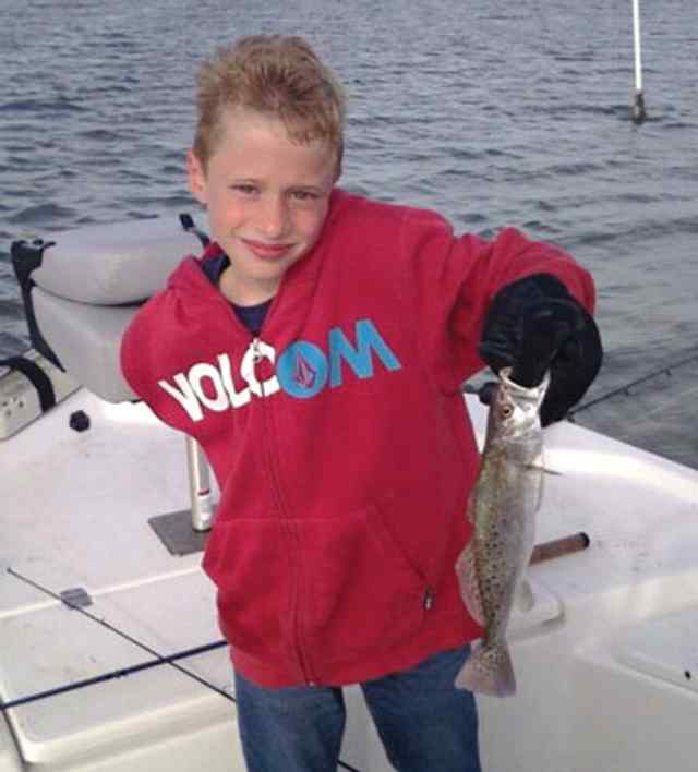 Nicklaus Brawner Woodlandsfirst trout!