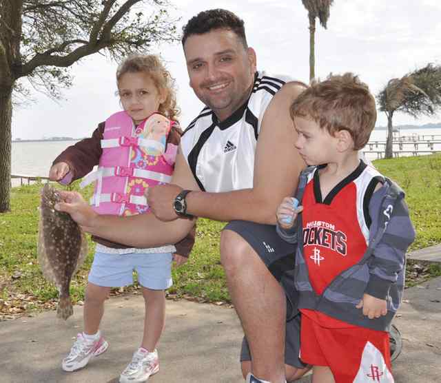 Gabi De La Fuente, proud Daddy, & baby brother (Kiko) Carancahua Bayfirst fish!