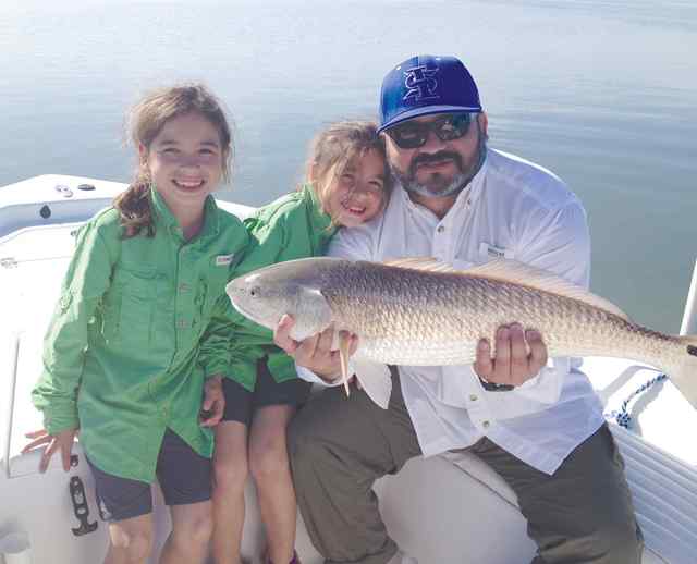 Kendall & Kahlen Castro with Dad Aransas Bay29.5&quot; redfish
