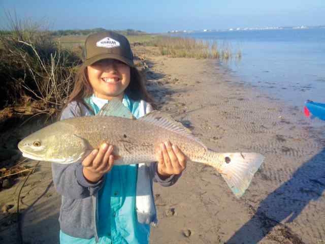 Ava Moreno St. Charles Bay - 22" redfish, first keeper!