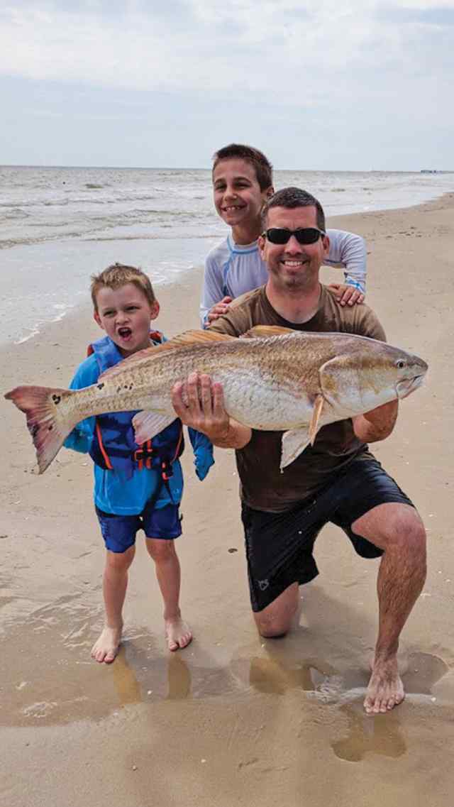 David Johnston with Jake & Cooper Matagorda Beach - 37" personal best redfish!