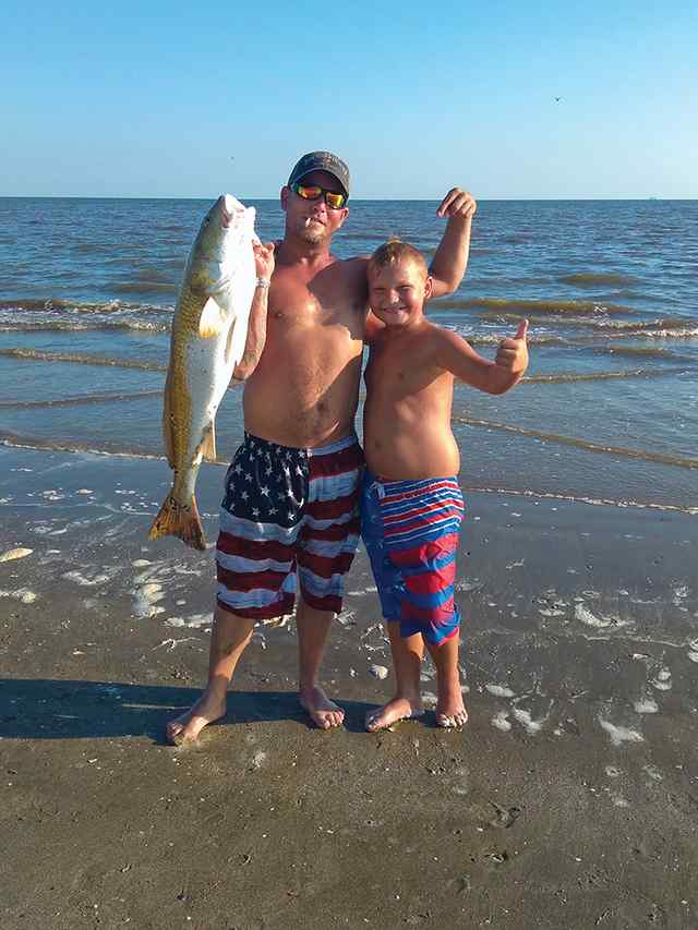Triston Burchett, with dad (John Burchett II) Holly Beach - redfish