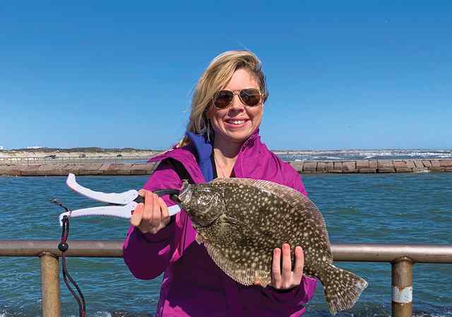 Karen Karner Corpus Christi jetties - 18" personal best flounder!