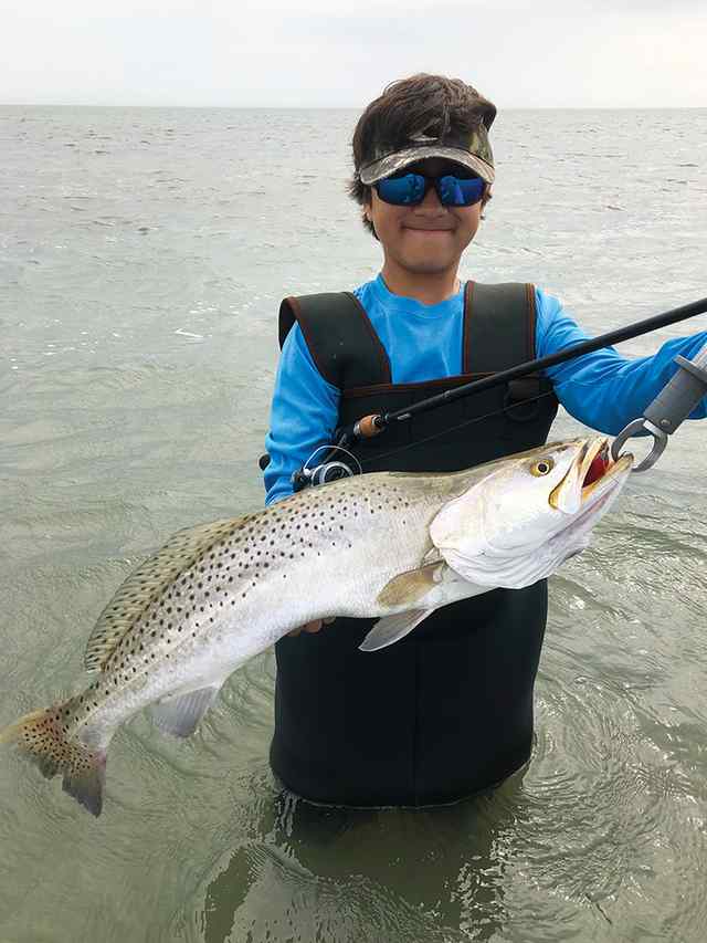 Nicholas Jimenez Lower Laguna Madre - 27" personal best trout! Caught on red/white Kwiggler ball tail