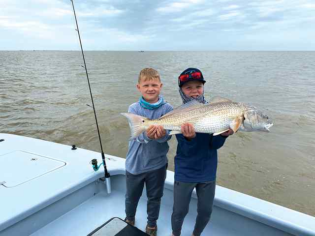 Kaison Thompson & Paxton McIntyre Matagorda Bay - 38" redfish, tag-teamed