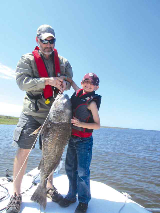 Connor Lyons with dad Lake Calcasieufirst monster black drum!