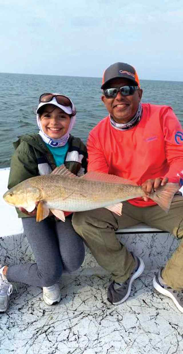 Cali Perez Lower Laguna Madre - 27.5" first redfish! Caught on a white gulp