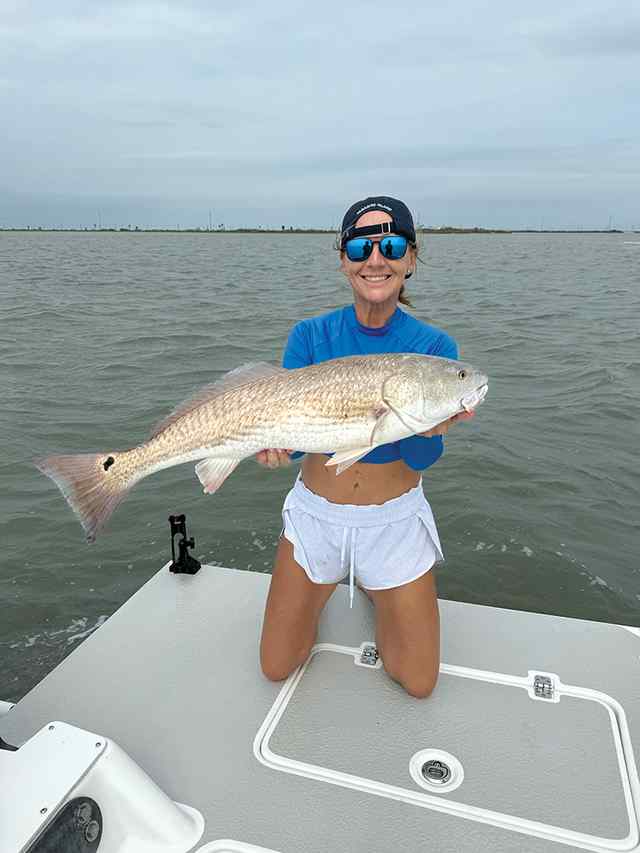 Heather Rowe Stedman Reef - 31" redfish, caught on shad