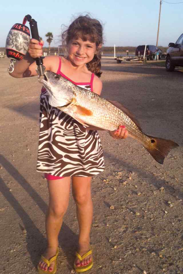Summer Clark First redfish while fishing with Nana and Papa!