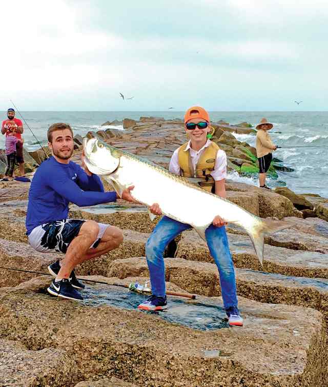 Austin & Nick Jackson Jetty tarpon - Nick caught it, Austin landed it