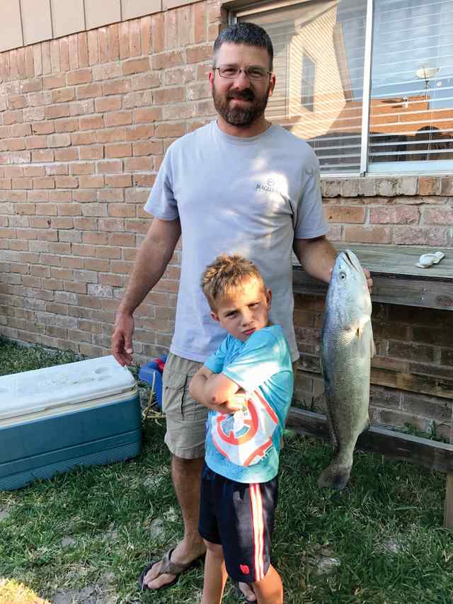 Trevor Shaver with son, Caleb Portland - 28.25" trout, caught on kayak