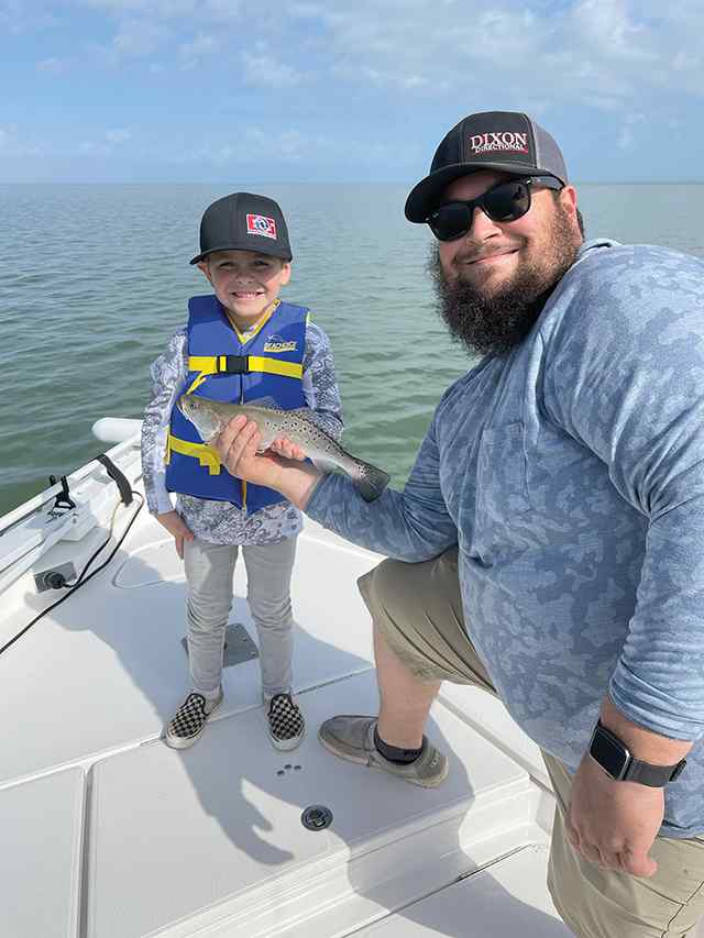 Ellis Halverson with dad East Matagorda Bay - first trout!