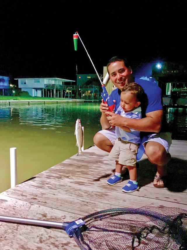 Payton Davies with great grandfather Vernon Broussard San Luis Pass - speckled trout, first fish! CPR