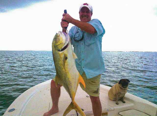 Jeff Reininger, with Max the pug West Galveston Bay - jack crevalle