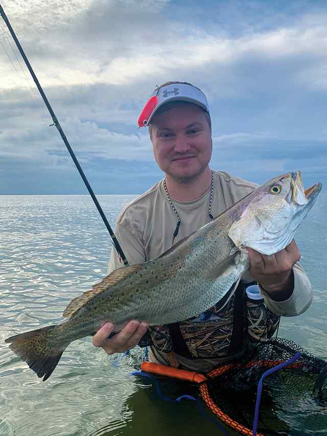 Wes Wedelich trout, caught in the surf on a topwater
