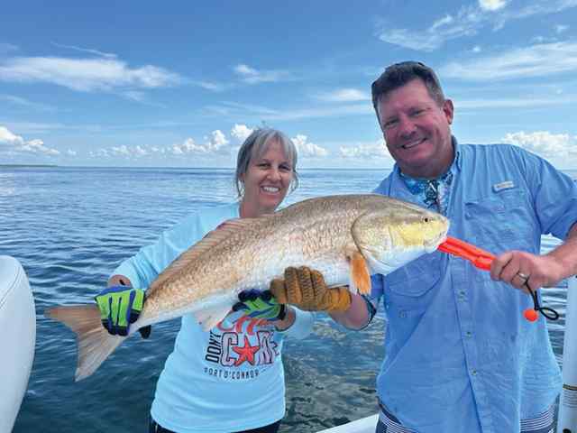 Angel Gidak with Kevin Gustainis West Matagorda Bay - first fish!