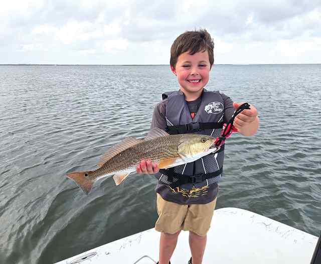Levi Beyer Redfish Bay - 19" first redfish! CPR, first saltwater fishing trip!