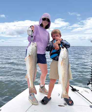Brantley Harding & mom 31.5" redfish