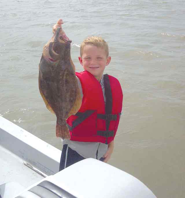 Ethan Hughes West Galveston21&quot; first flounder!