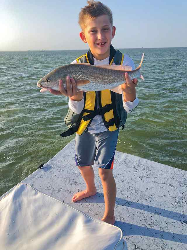 Rhett Strauss Upper Laguna Madre - 20" first redfish! Sight casted with a gold spoon.