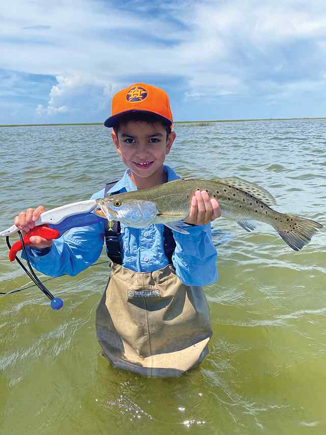 Joseph Port O'Connor - 20" first keeper trout! Caught on live croaker