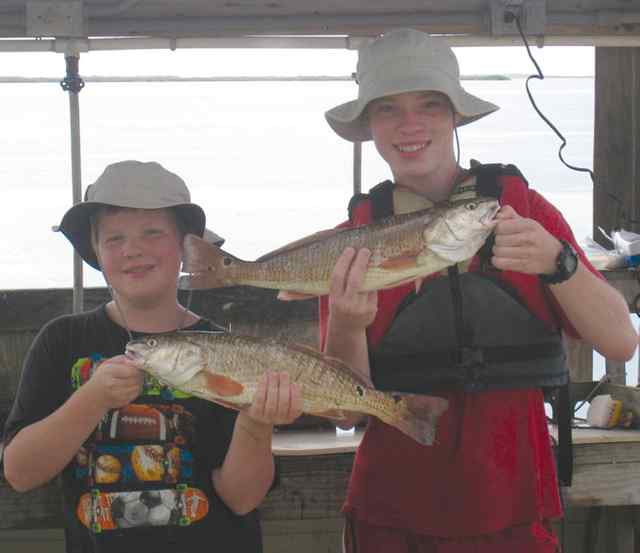 Cody & Nicholas Eckert Rockportfirst redfish!