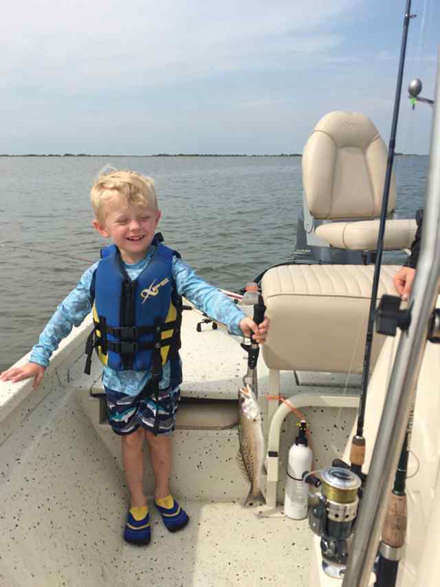 Townes Petrick first speckled trout!Set hook, reeled in, and landed himself!