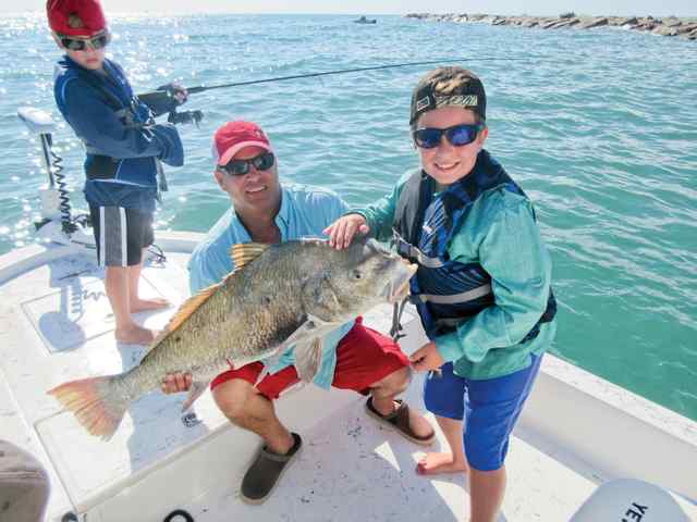 Vincent Kalisky with dad Port Aransas jetties - 38" black drum