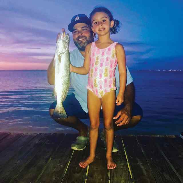 Harper with dad, Jarrett Mearns West Galveston Bay - 23" speckled trout, first big catch!