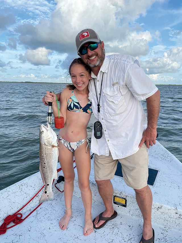 Audrey Rouse with Charlie Williamson West Galveston Bay - 24" 6 lb redfish CPR, caught on a 5 inch Hogie sand eel on a quarter ounce jig head on a St. Croix mojo bass 7 ft. medium action rod with a Lews speed spool bait casting reel