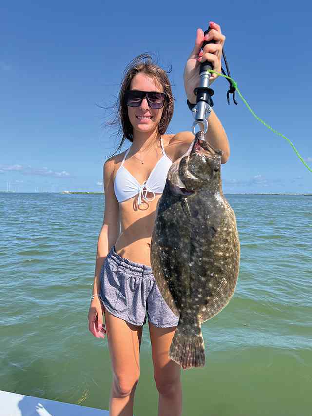 Paige Halberda Upper Laguna Madre - 18" flounder, caught under a popping cork off a shallow spoil