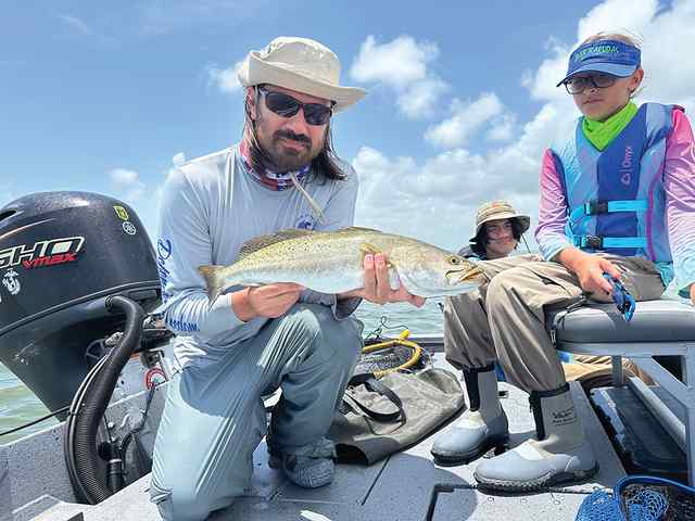 Walter with Ian & Makayla 23.5" trout