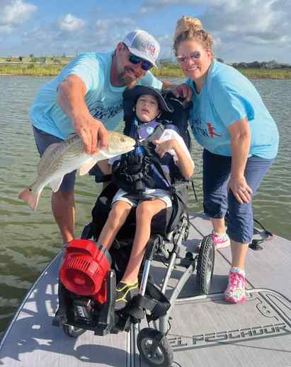Cooper Kirkland with parents, Cody & Dana CAST for Kids in Rockport - 22" redfish