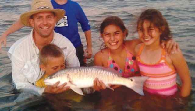 Carlos Mejia with son, Scott Mejia 28&quot; first redfish! CPR