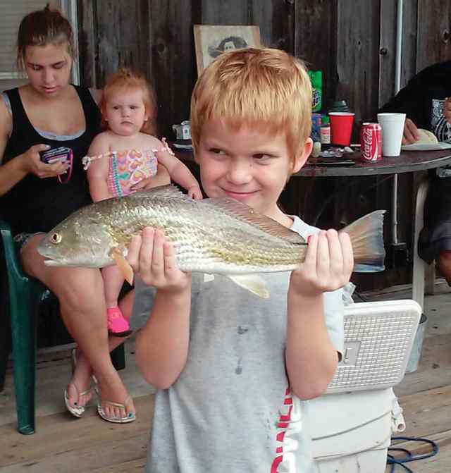 Cody Grace Magnolia Beachfirst cast on his Spiderman rod n reel – first redfish!