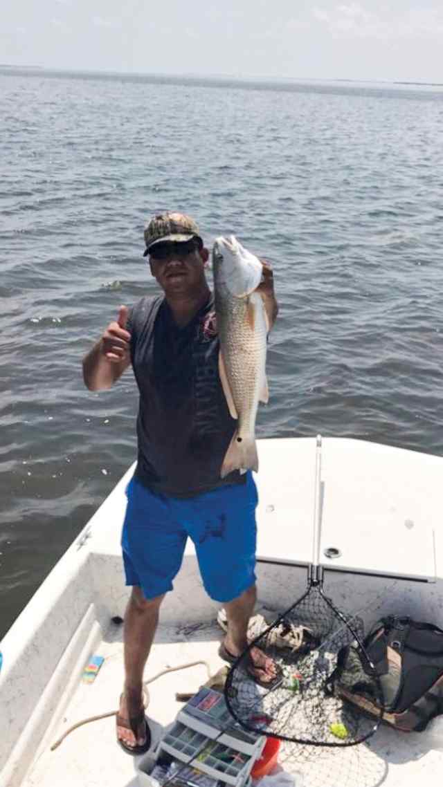 Oliver Banda Port Mansfield - 24" red drum, caught on a gold spinner bait