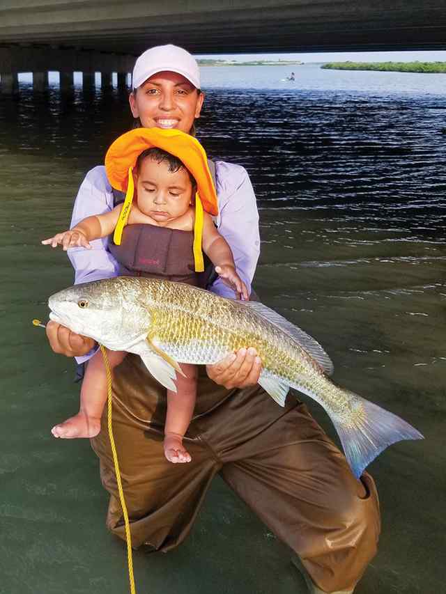 Maricela Morales and son, Fisher spotless redfish