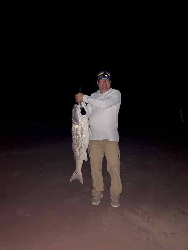 Charles Chapman surf fishing - 42" 34 lb first bull red!