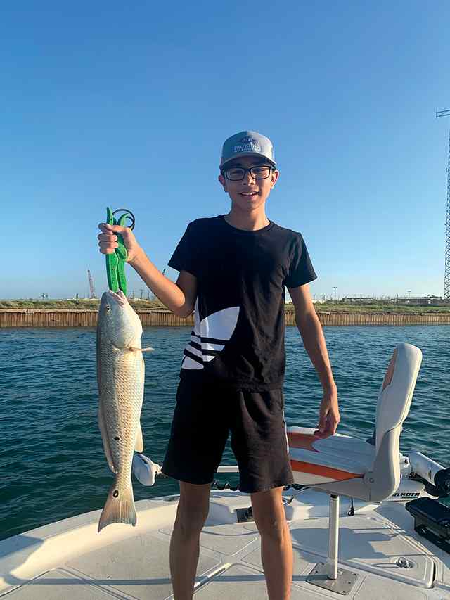 Vicente Easley Port Aransas - 24" first redfish!