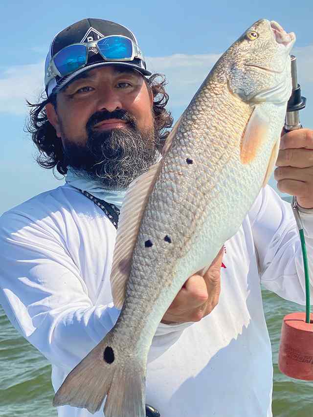 John Vann Trinity Bay - 24" redfish, caught on a popping cork with chartreuse gulp swim mullet
