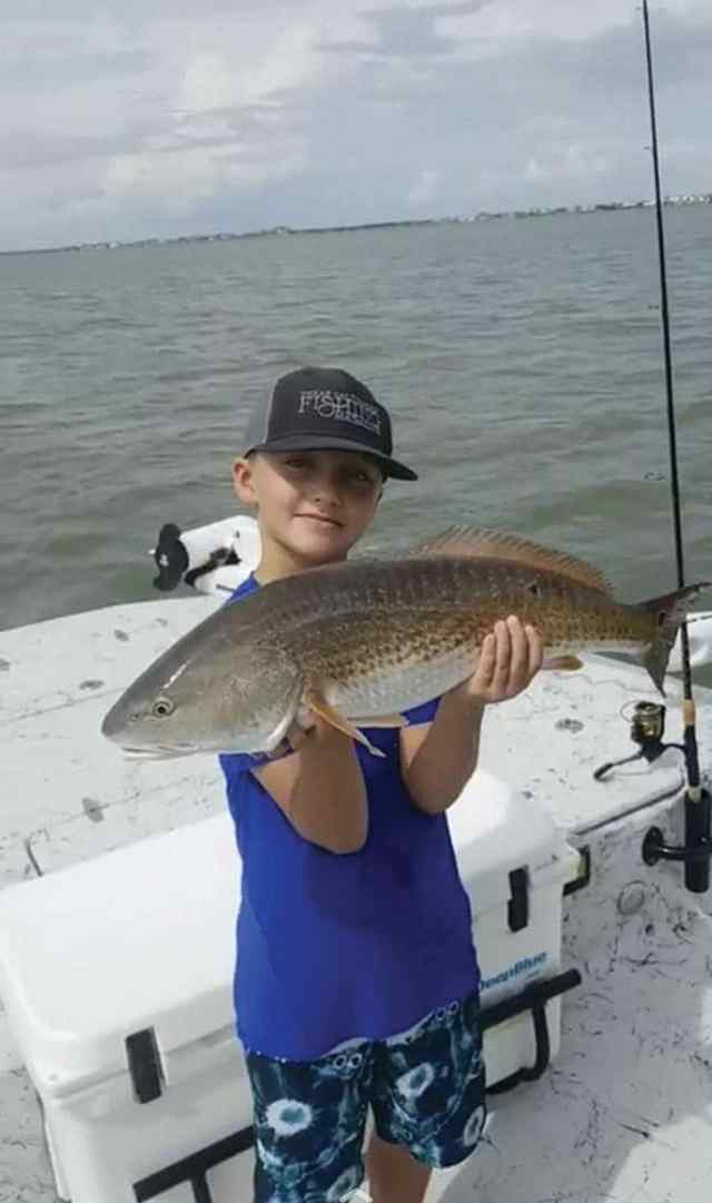 Landon Waits Aransas Bay - 26" personal best red! Wearing favorite lucky hat