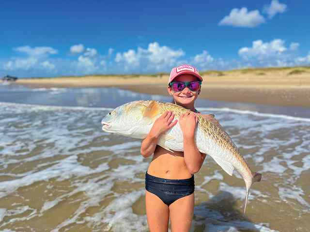 Analeigh Turner 42" redfish, pulled in with help of dad
